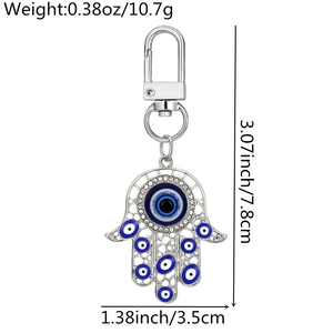 Detail view of Hamsa Hand and Evil Eye keychain with silver finish and crystal inlay