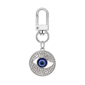 Silver evil eye keychain with blue crystal center and sparkling rhinestones for bags