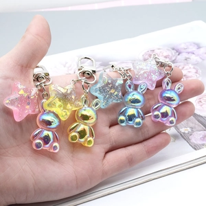 Colorful resin bunny and star keychains with metallic iridescent finish for bags