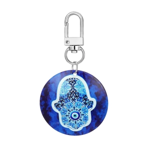 Detail of blue marble acrylic evil eye keychain with silver lobster clasp and Hamsa symbol