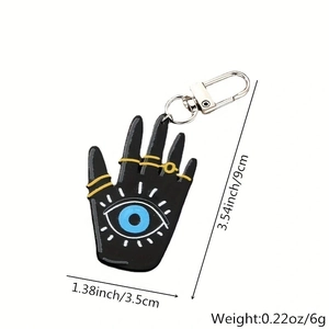 Detailed view of Evil Eye and Hamsa Hand keychain with size markers 3.54x1.38 inches