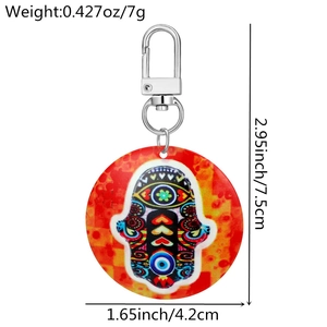 Detail view of colorful acrylic Hamsa keychain showing dimensions 7.5cm by 4.2cm and 7g weight