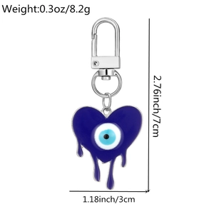 Detailed view of evil eye heart keychain with 7cm total length and silver carabiner