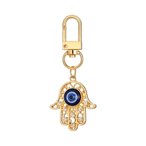 Detailed view of Hamsa Hand keychain with blue evil eye and sparkling rhinestones