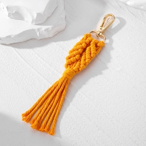 Handmade bohemian cotton rope leaf keychain in bright orange with golden lobster clasp