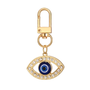 Golden Evil Eye keychain set with sparkling crystals and blue enamel eye pendant charms