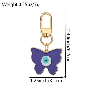 Détail de porte-clés papillon œil maléfique en alliage doré avec dimensions du produit