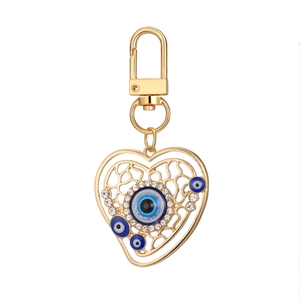 Porte-clés œil de protection en forme de cœur avec alliage doré et émail bleu brillant