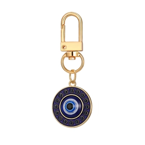 Golden Evil Eye keychain with blue rhinestones and lobster clasp on white background