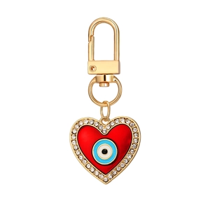 12Pcs Evil Eye heart keychains with red enamel, gold alloy finish, and sparkling crystals