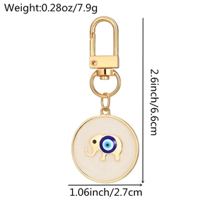 Detailed view of evil eye elephant keychain with gold finish and enamel dimensions