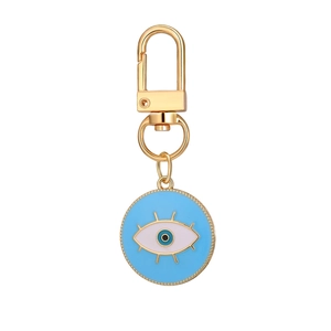 12-piece evil eye keychain set with colorful enamel pendants and gold elephant charms