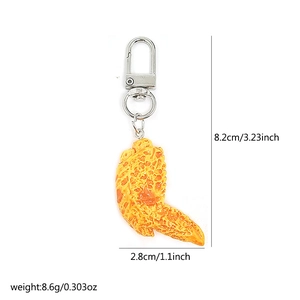 Detailed view of creative fried chicken wing keychain with precise size dimensions