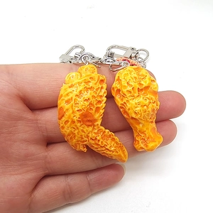Realistic fried chicken wing and drumstick keychain set with a golden crispy texture