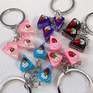Miniature simulation layered cake keychain with strawberry and cream toppings in multiple colors