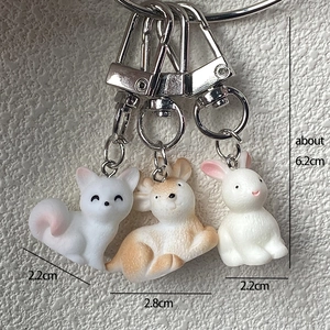 Detailed size view of resin animal charms showing dimensions for fox and rabbit keychain