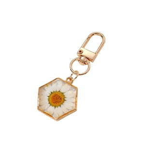 Hexagonal resin keychain with real white daisy dried flower and golden metal ring