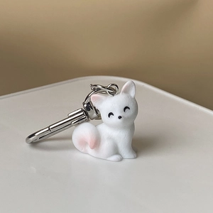 Cute resin 3D animal keychain featuring a white dog with pink accents and silver hook