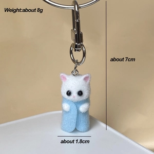 Detailed view of flocked cat keychain with measurements of 7cm height and 8g weight