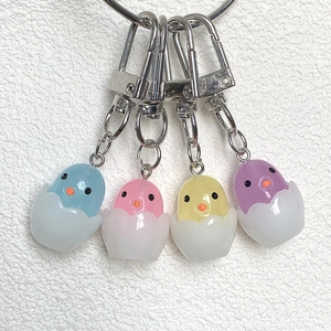 Cute cartoon hatching chick keychains in pastel blue, pink, yellow and purple resin