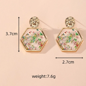 Detailed size view of hexagonal gold earrings with real dried flowers measuring 3.7cm by 2.7cm