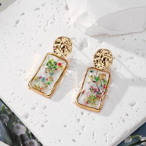 Golden rectangular resin drop earrings with colorful dried flowers in pastoral style