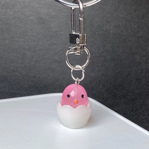 Cute pink chicken in eggshell keychain with silver metal clasp and polished resin finish