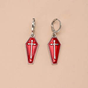 Detail view of gothic coffin earrings with red enamel and silver cross decoration