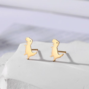 Minimalist tiny gold dinosaur stud earrings in polished stainless steel for women