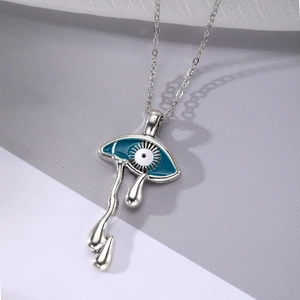 Polished silver evil eye pendant necklace with blue enamel and metallic teardrops