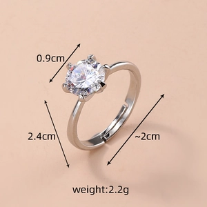 Detailed view of single crystal ring showing 0.9cm round zircon and adjustable band