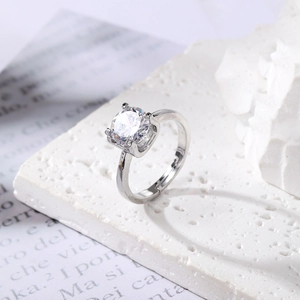 Luxury silver adjustable ring featuring a round solitaire crystal with four-prong setting