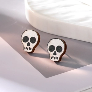 Halloween wooden skull stud earrings with detailed white printing on dark wood texture