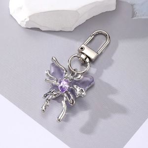 Elegant purple crystal butterfly keychain with silver liquid metal wings for women bags