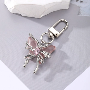 Detail of pink crystal butterfly keychain with silver metal lobster clasp and gemstone