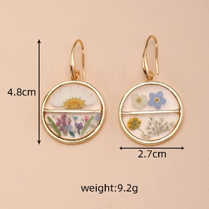 Detail showing dimensions of round dried flower earrings with gold alloy frame