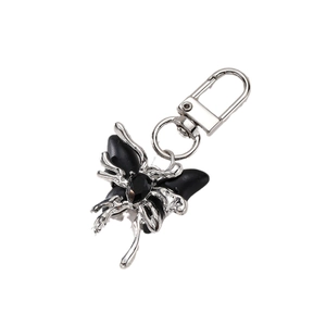 Gothic butterfly keychain with black resin wings and silver metal clasp for handbags