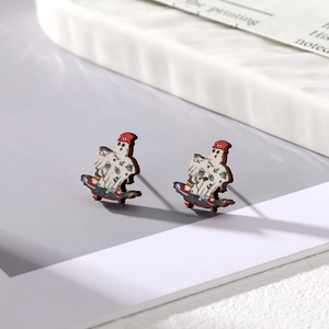 Detail view of Halloween ghost on skateboard wooden stud earring with cute red hat motif