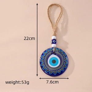 Detail showing the 7.6cm large Evil Eye acrylic pendant with 22cm hanging rope length