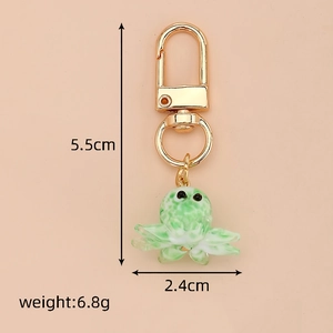 Detail view of green glass octopus keychain with dimensions 5.5cm height and weight 6.8g