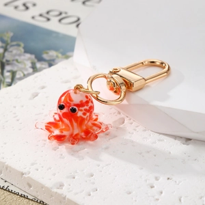 Cute mini glass octopus keychain with red stripes and golden metal lobster clasp