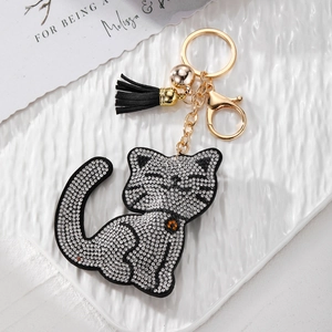 Porte-clés chat en strass avec pompon en cuir noir et anneau doré pour sac à main luxe