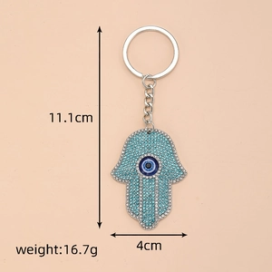 Detail view of Hamsa Hand keychain with blue rhinestones and 11.1cm size marking