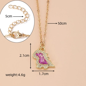 Detail view of gold dinosaur necklace with pink opal resin and white rhinestones inlay