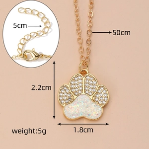 Macro view of opal cat paw pendant with gold chain and lobster clasp closure detail