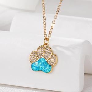 Elegant gold-plated opal necklace featuring a blue paw print pendant with white zircon accents