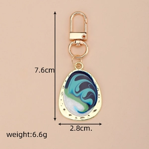 Detail view showing dimensions of a colorful drip oil enamel irregular keychain pendant