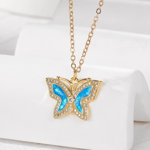 Elegant gold-plated butterfly necklace with blue opal stones and sparkling zircon accents