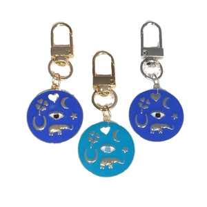 Three-piece Evil Eye keychain set with blue enamel pendants and lucky metal charms