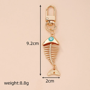 Detailed view of fishbone alloy keychain with blue devil eye, size 9.2cm x 2cm